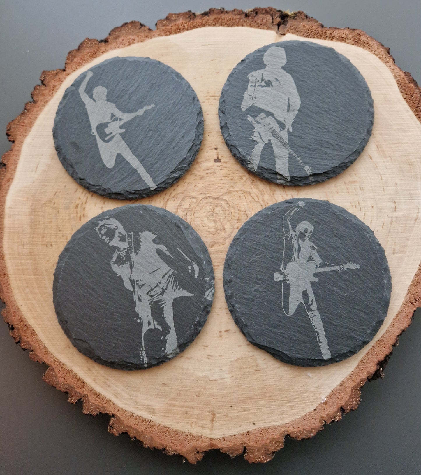 Slate coasters on log slice