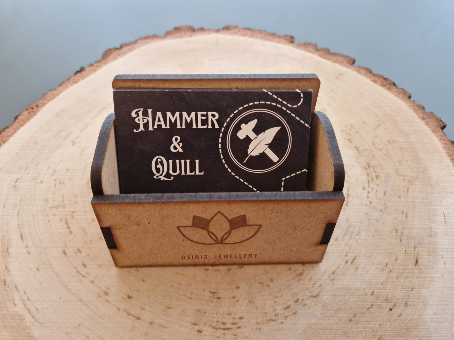 wooden business cardholder displayed on log slice