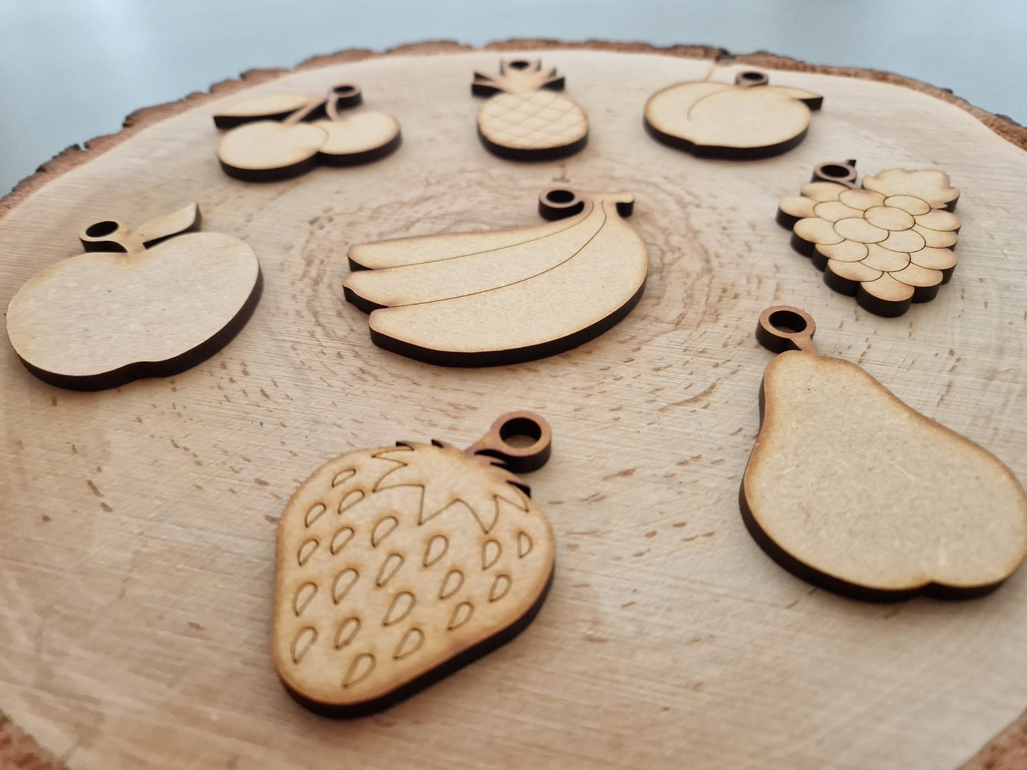 wooden fruit shape displayed on wooden background