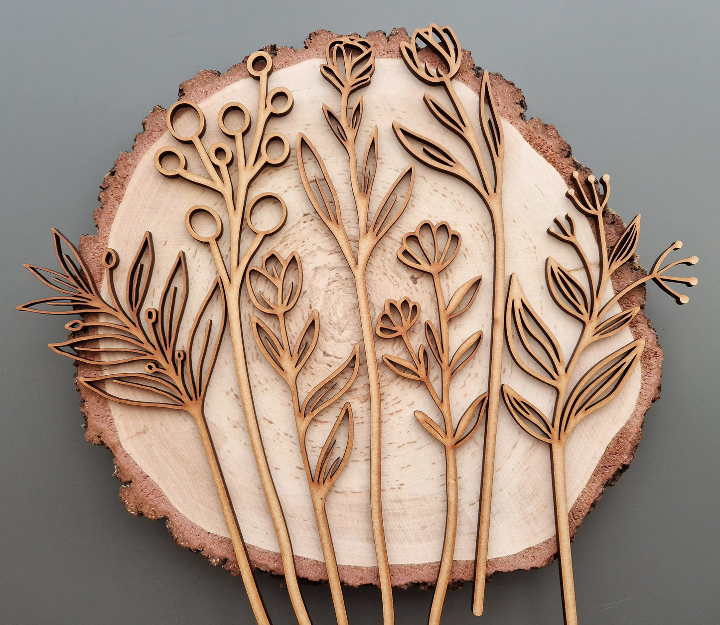 wooden flowers displayed on log slice