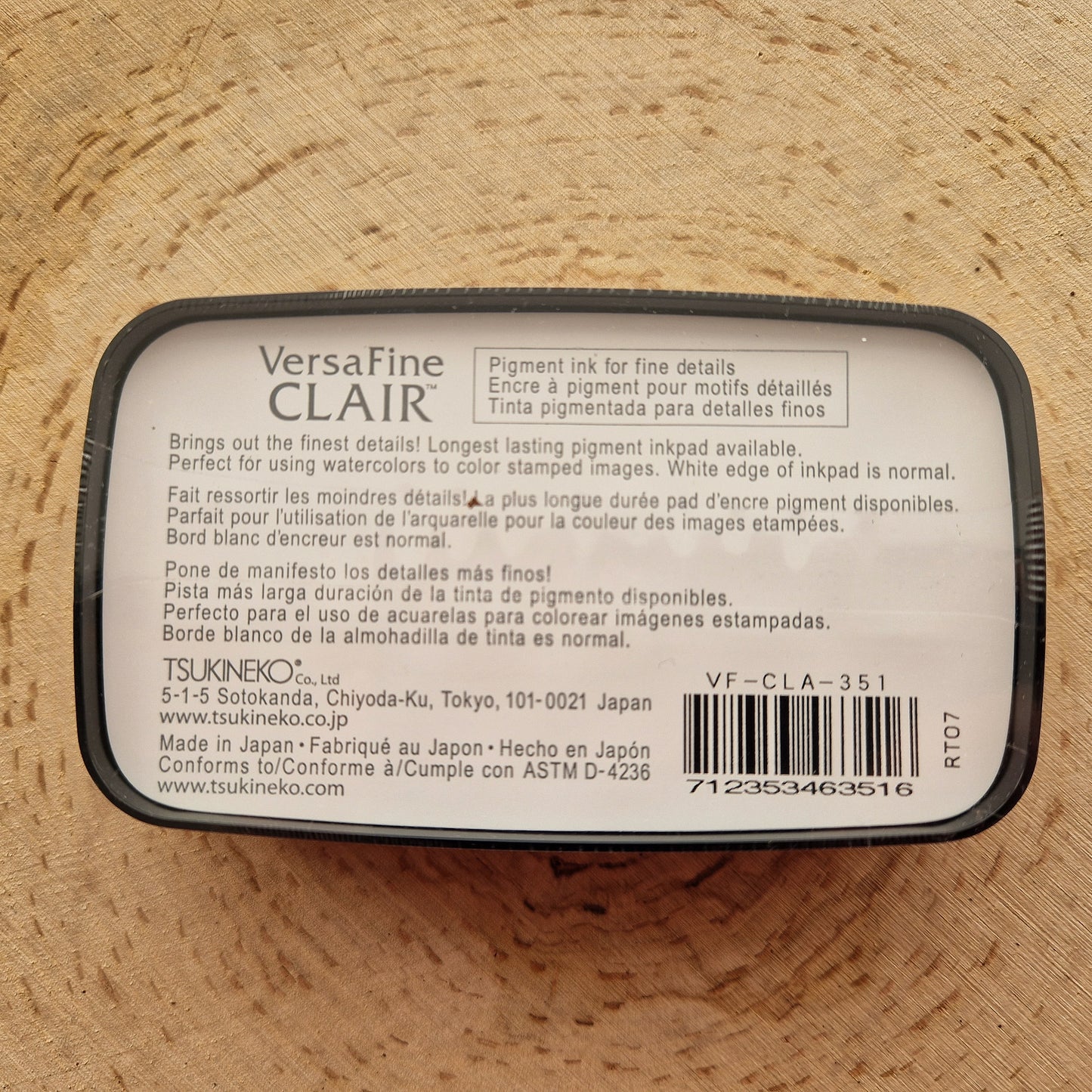 Versafine clair black ink pad displayed on wooden background