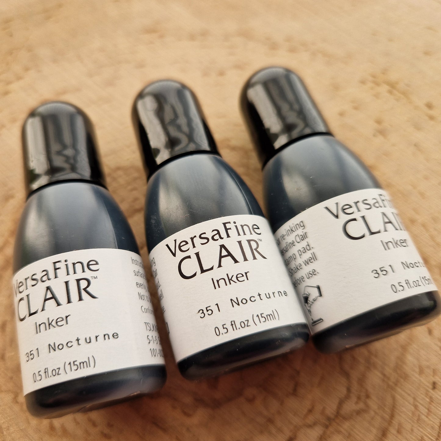 Versafine clair black inker displayed on wooden background