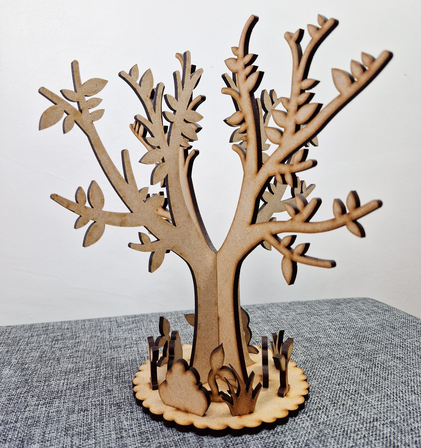 wooden tree with base displayed on grey background