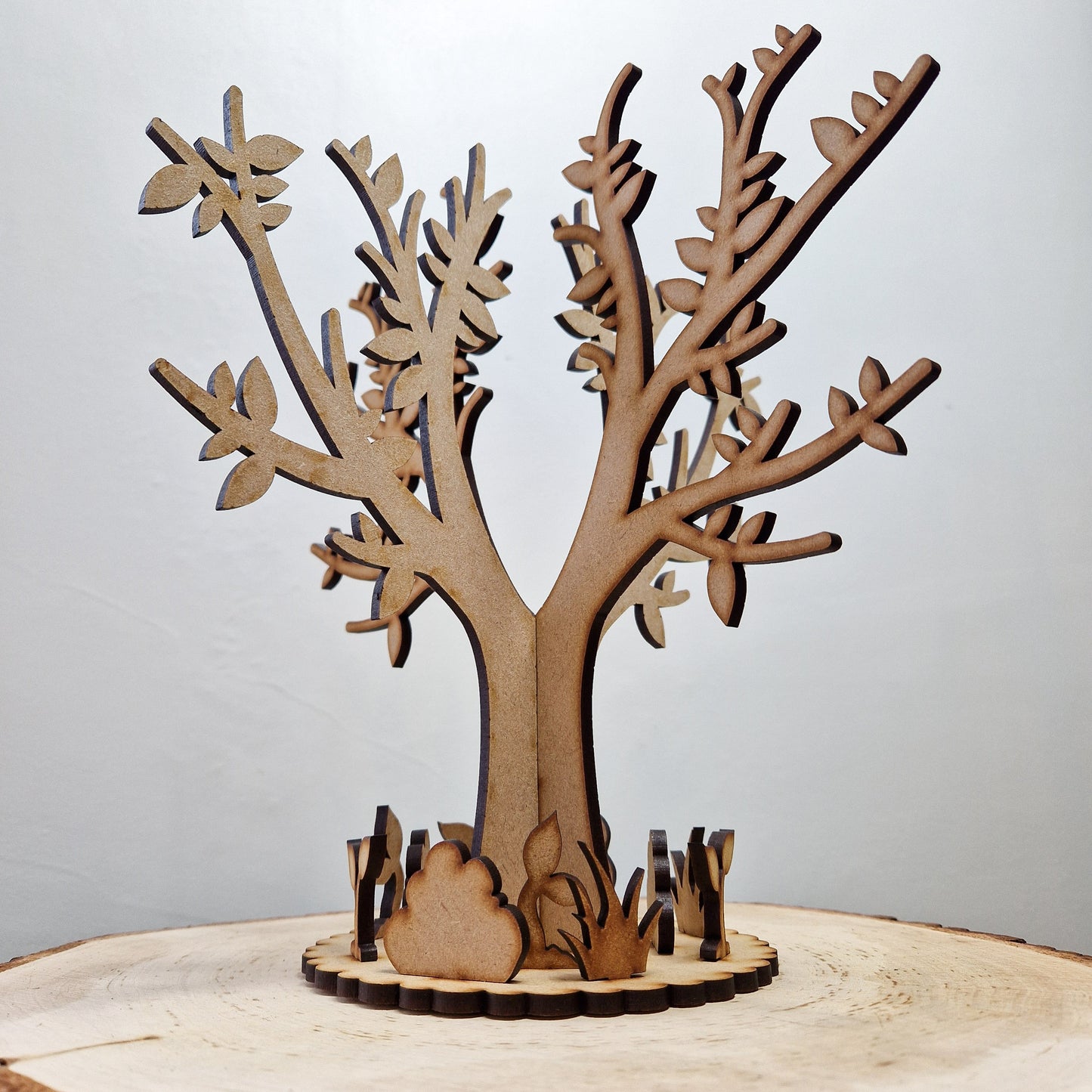 wooden tree with base displayed on grey background