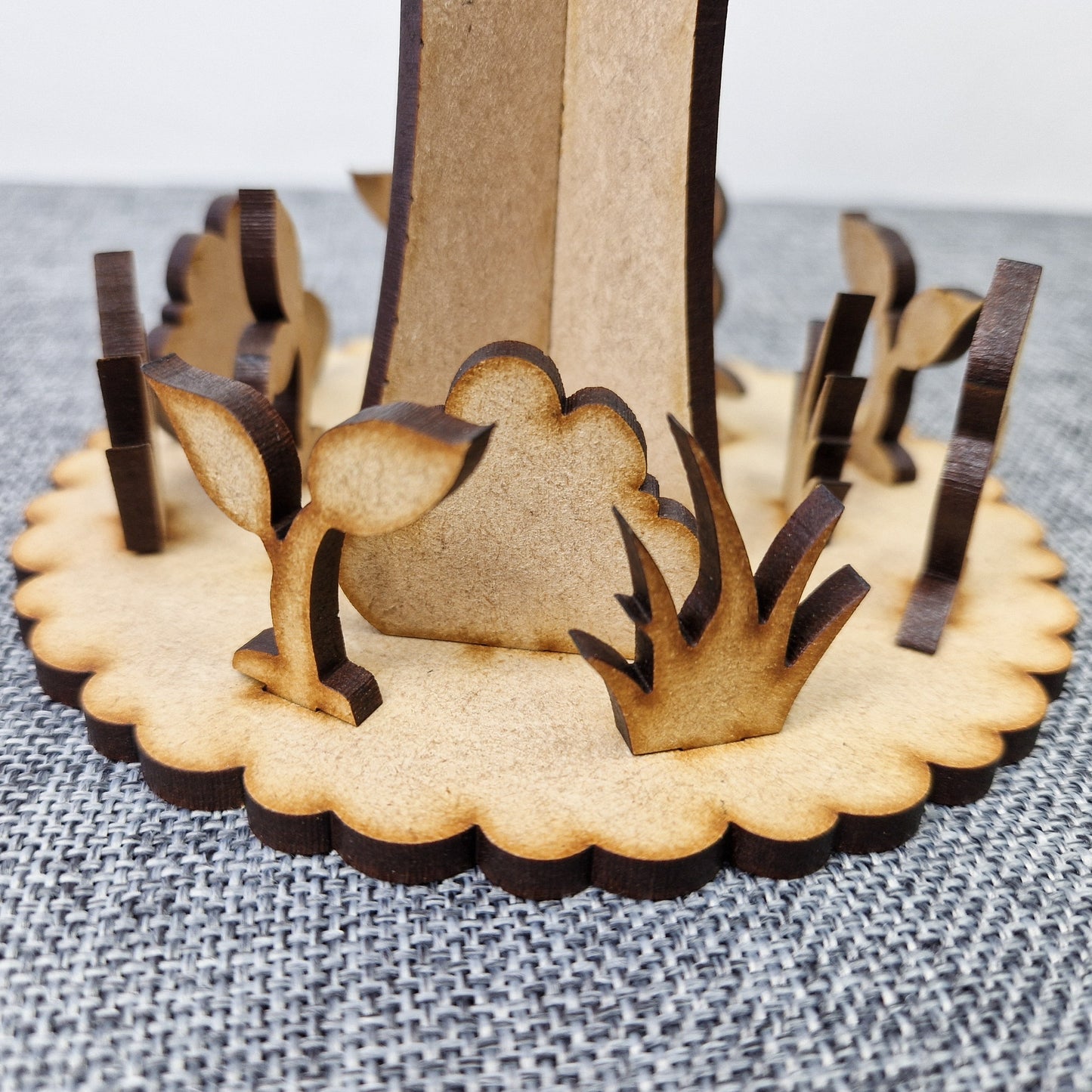 wooden tree with base displayed on grey background