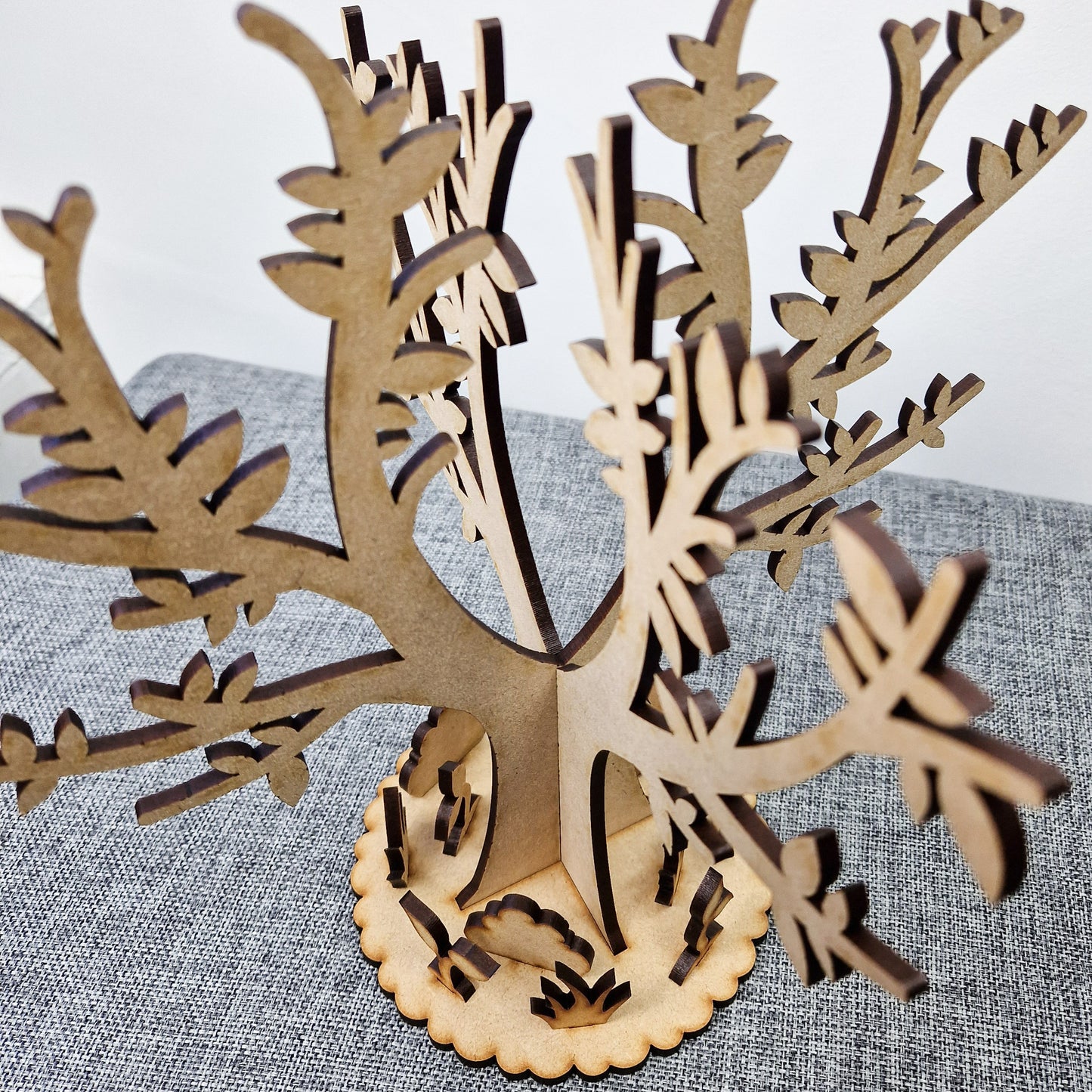 wooden tree with base displayed on grey background