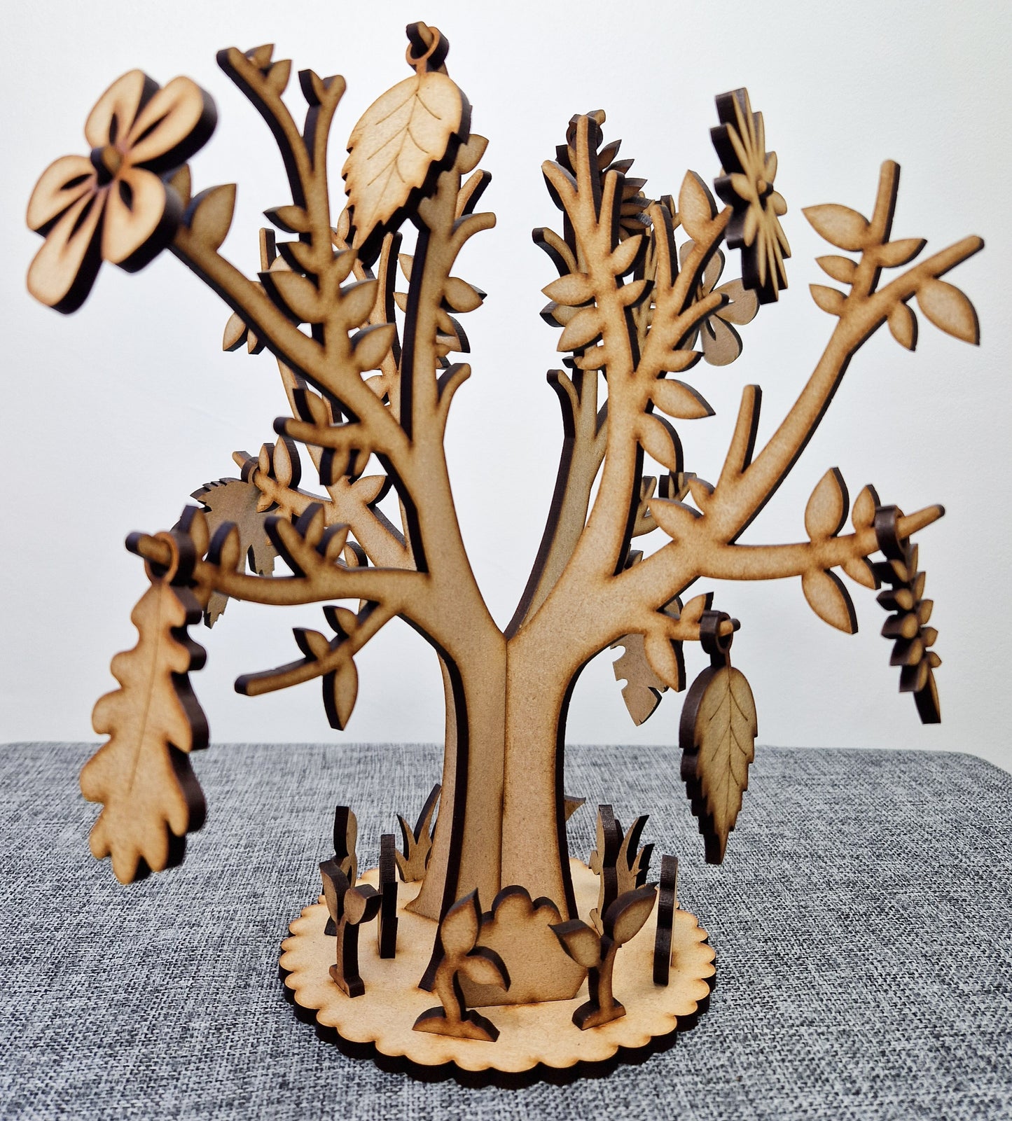 wooden tree with base displayed on grey background