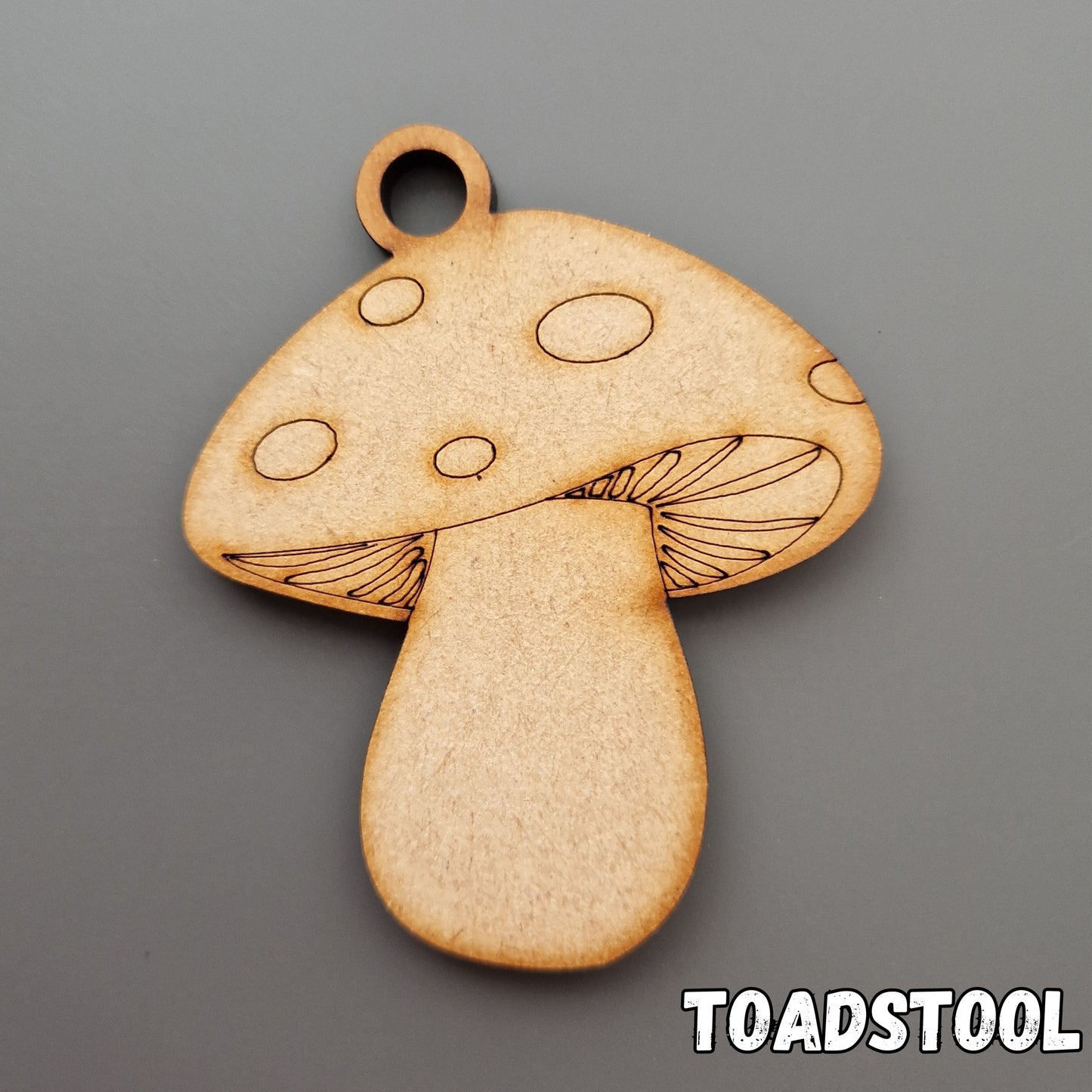 wooden toadstool shape displayed on grey background