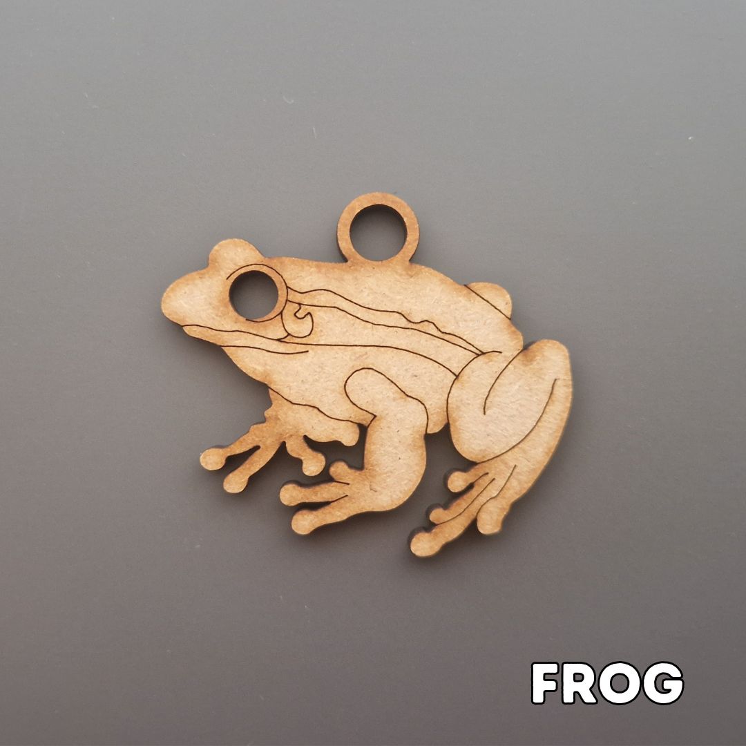wooden frog shape displayed on grey background