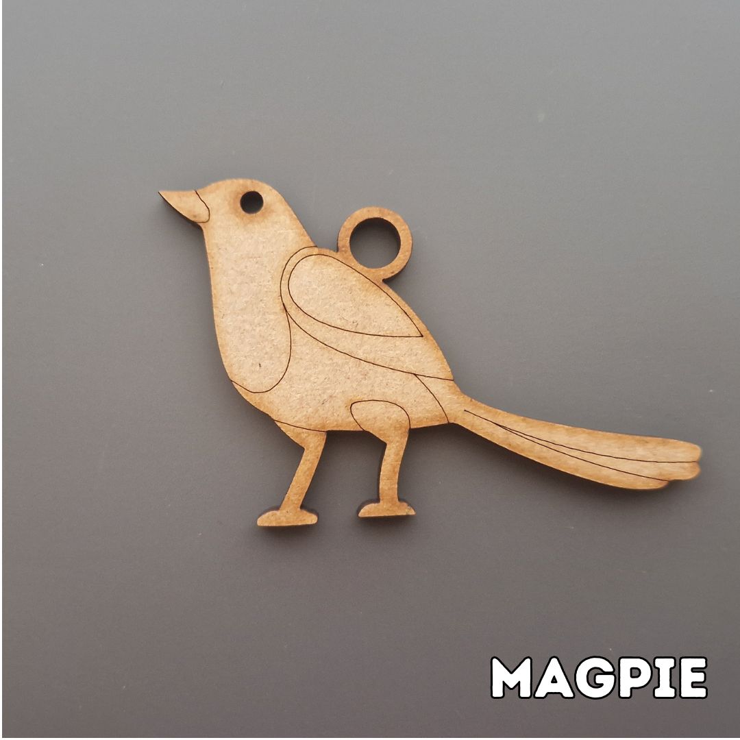 wooden magpie shape displayed on grey background