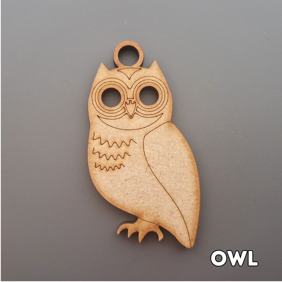 wooden owl shape displayed on grey background