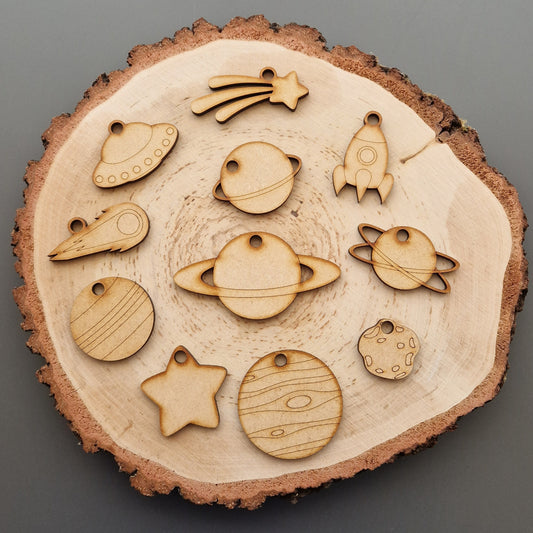 wooden space shapes on log slice