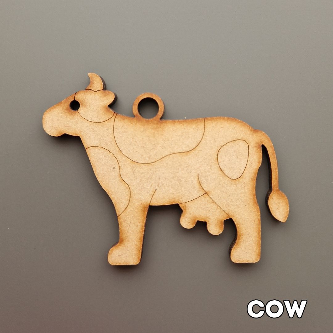wooden cow shape displayed on grey background