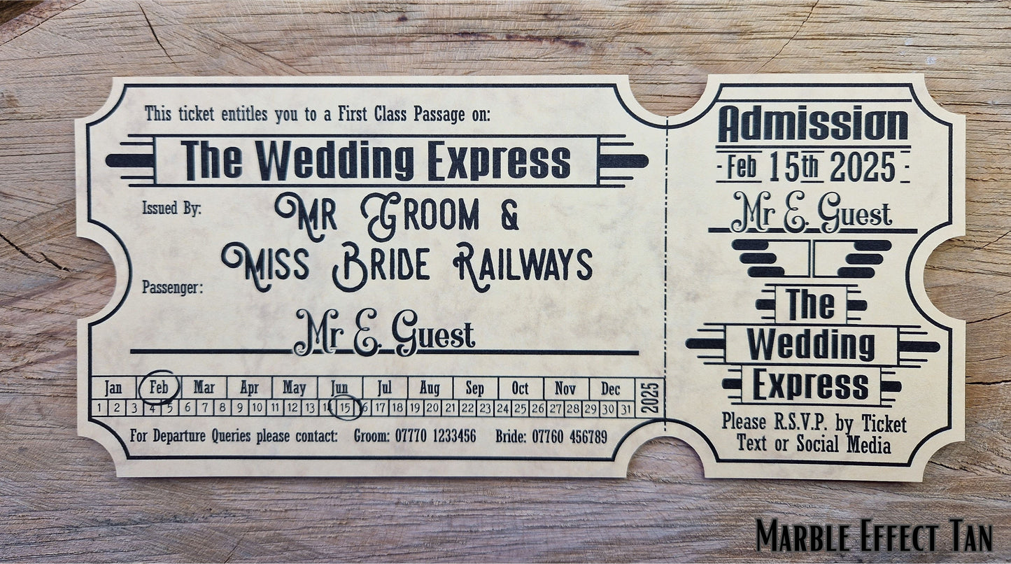 Vintage train ticket wedding invites displayed on a wooden background