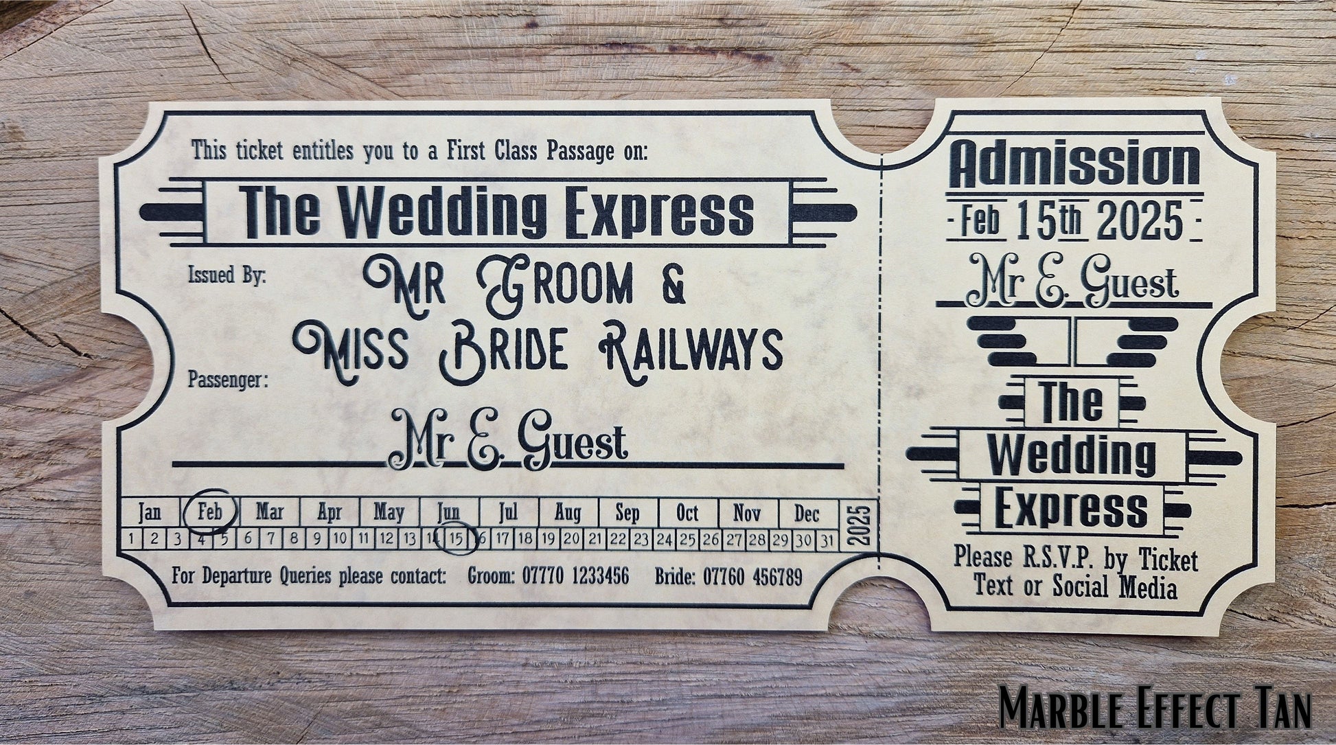 Vintage train ticket wedding invites displayed on a wooden background