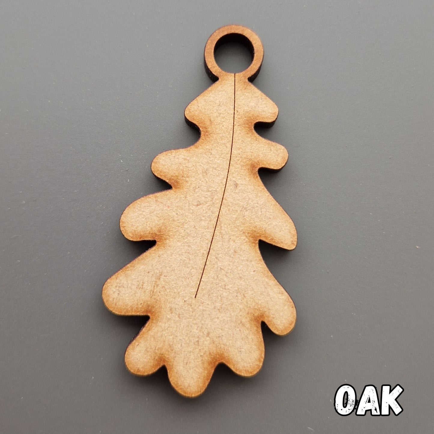 Wooden leaf shape displayed on grey background