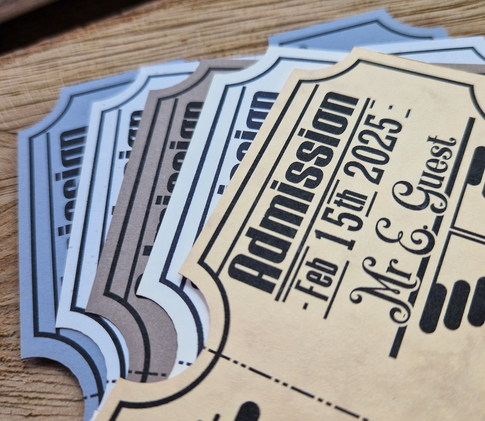Vintage train ticket wedding invites displayed on a wooden background