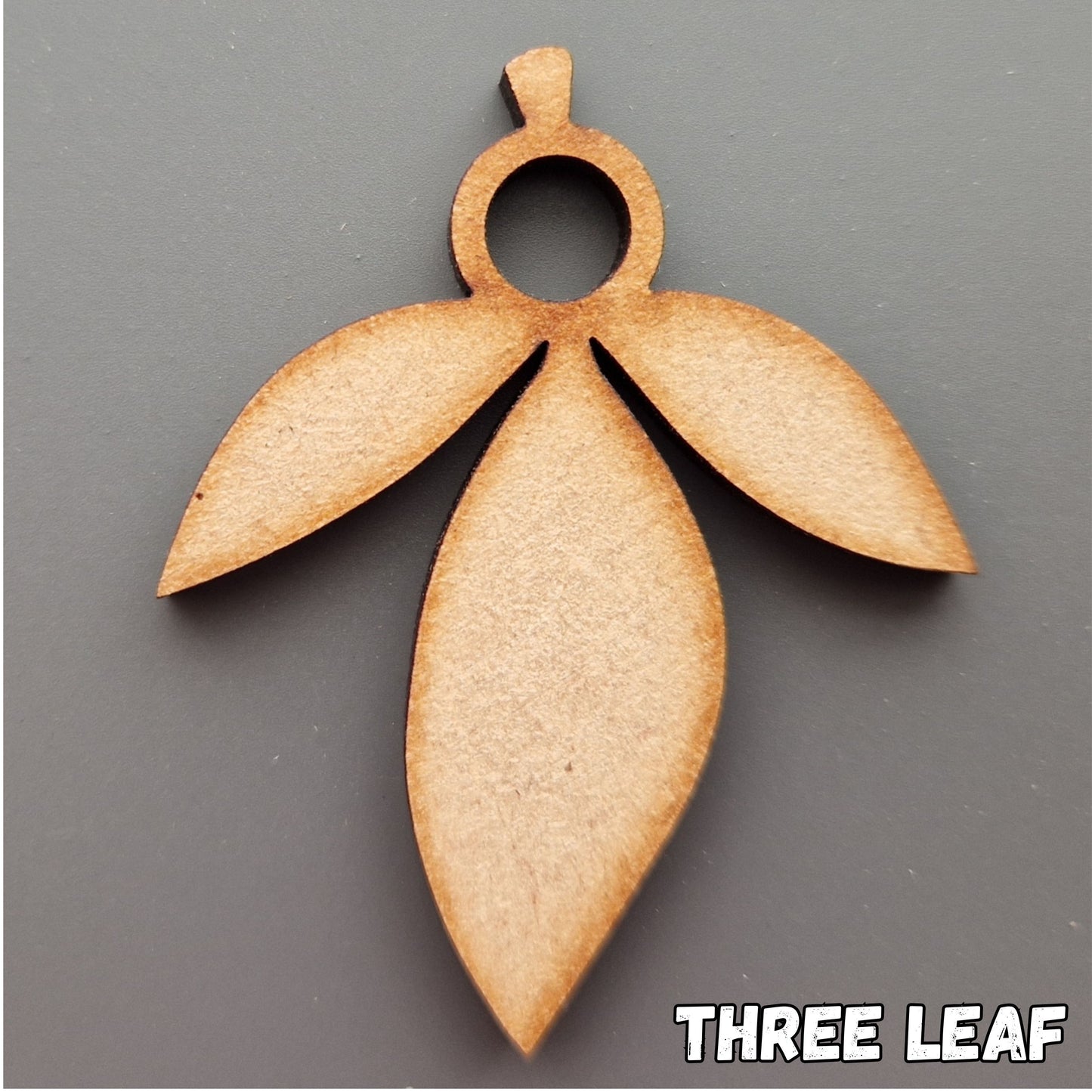 Wooden leaf shape displayed on grey background