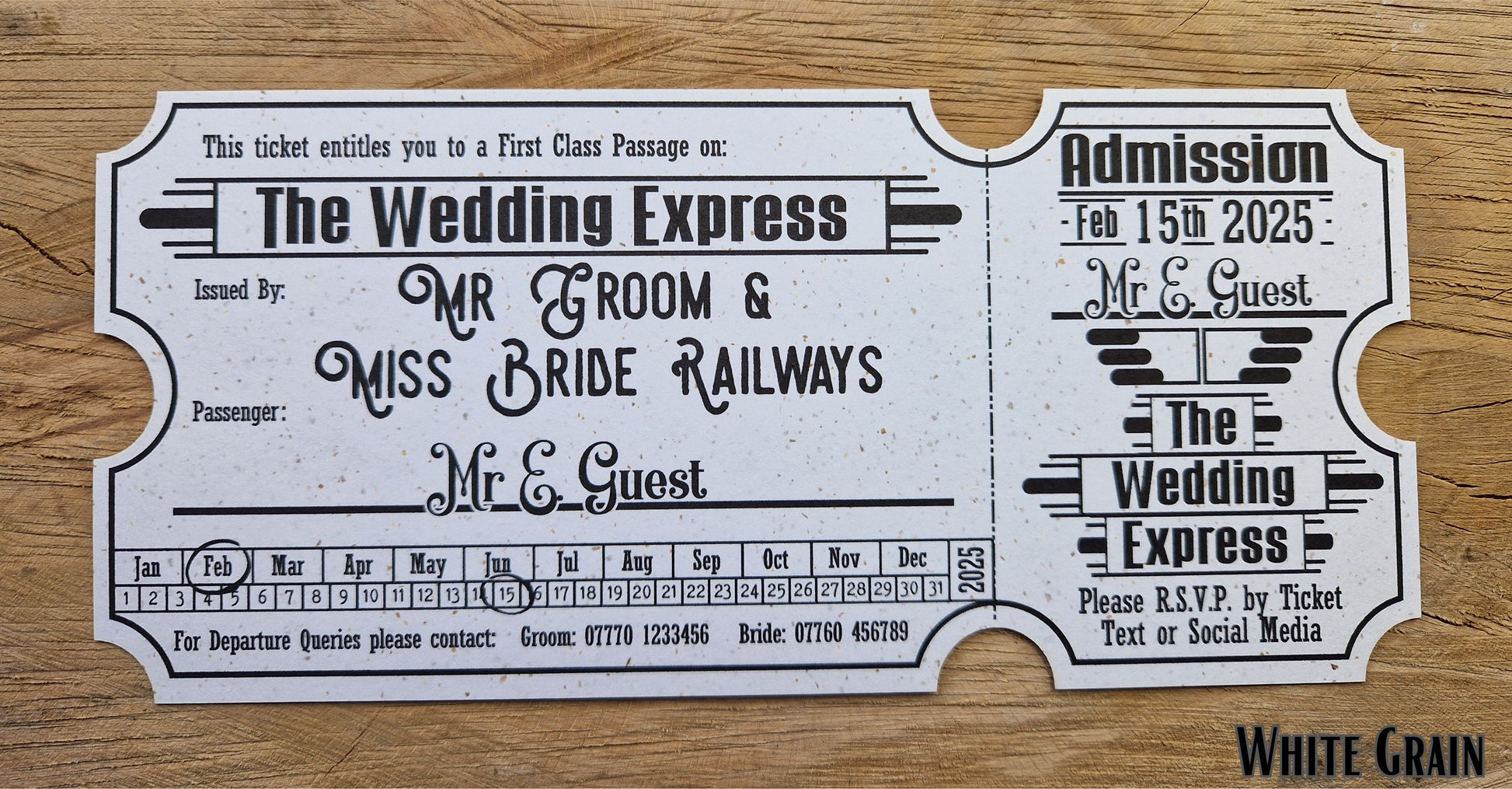 Vintage train ticket wedding invites displayed on a wooden background